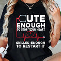 Funny Nurse Graphic T-Shirt for Men & Women - "Cute Enough to Stop Your Heart Skilled Enough to Restart It" Slogan with Stethoscope & Heart Design - Black Round Neck Short Sleeve Casual Tee - Machine Washable Nursing Apparel,
