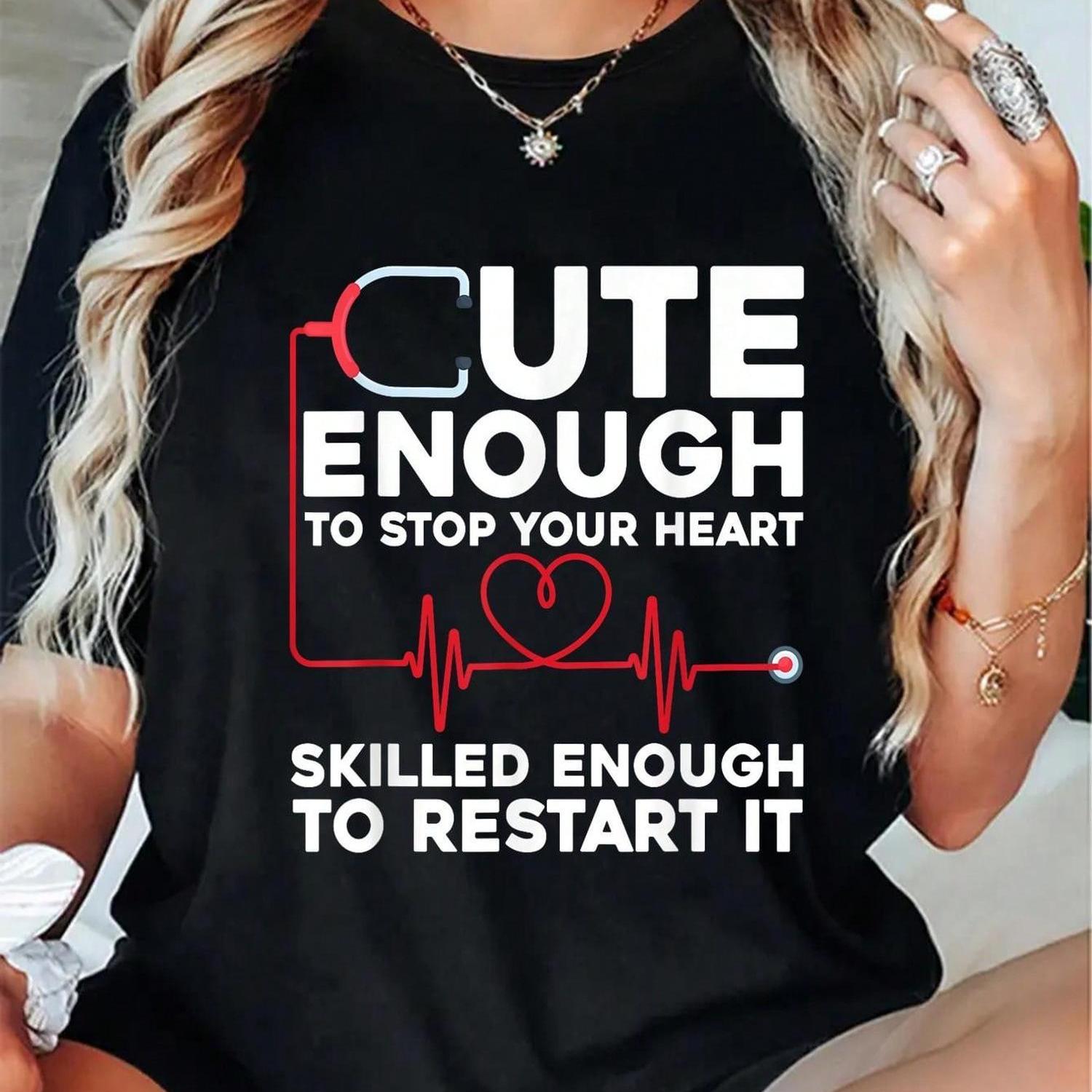 Funny Nurse Graphic T-Shirt for Men & Women - "Cute Enough to Stop Your Heart Skilled Enough to Restart It" Slogan with Stethoscope & Heart Design - Black Round Neck Short Sleeve Casual Tee - Machine Washable Nursing Apparel,