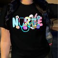 Women's Easter Nurse Graphic T-Shirt - Black Short Sleeve Crew Neck, Colorful Medical Themed Print, Soft Casual Top for Spring & Summer
