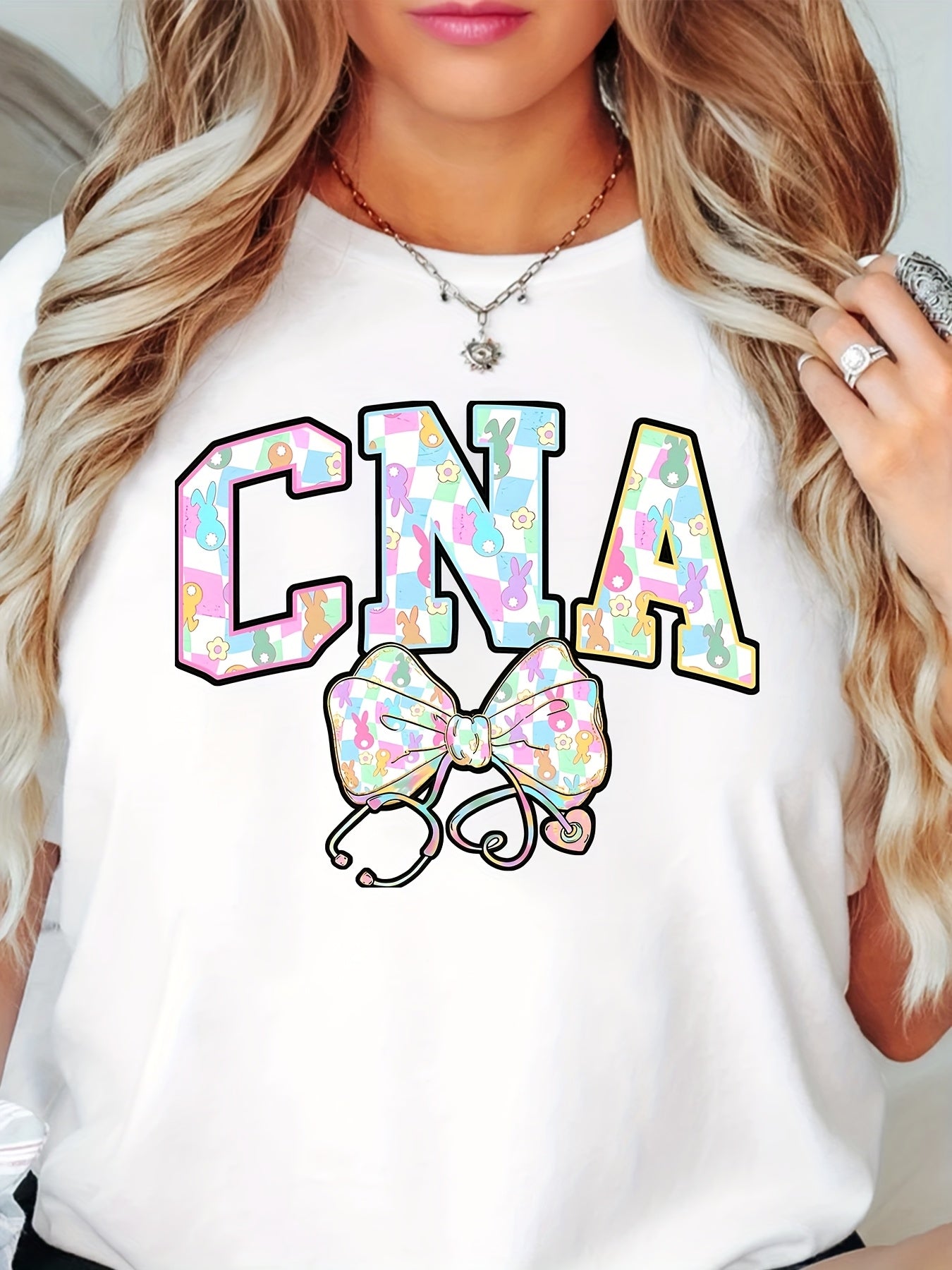 Women's CNA Nurse Bunny Graphic T-Shirt - 100%, Short Sleeve, Round Neck, Machine Washable, Playful Easter Design with Colorful Bunny Ears & Stethoscope, Spring/Summer Casual Tee for, Spring Fashion Top | Casual Round Neck |