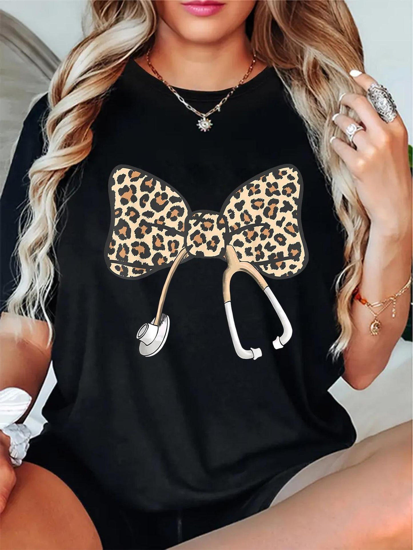 Women's Leopard Print Bow & Stethoscope Graphic T-Shirt - Casual Short Sleeve Tee, Black Nurse-Themed Top for Medical Professionals, Casual Wear | Bold Graphic Tee | Durable Print Shirt