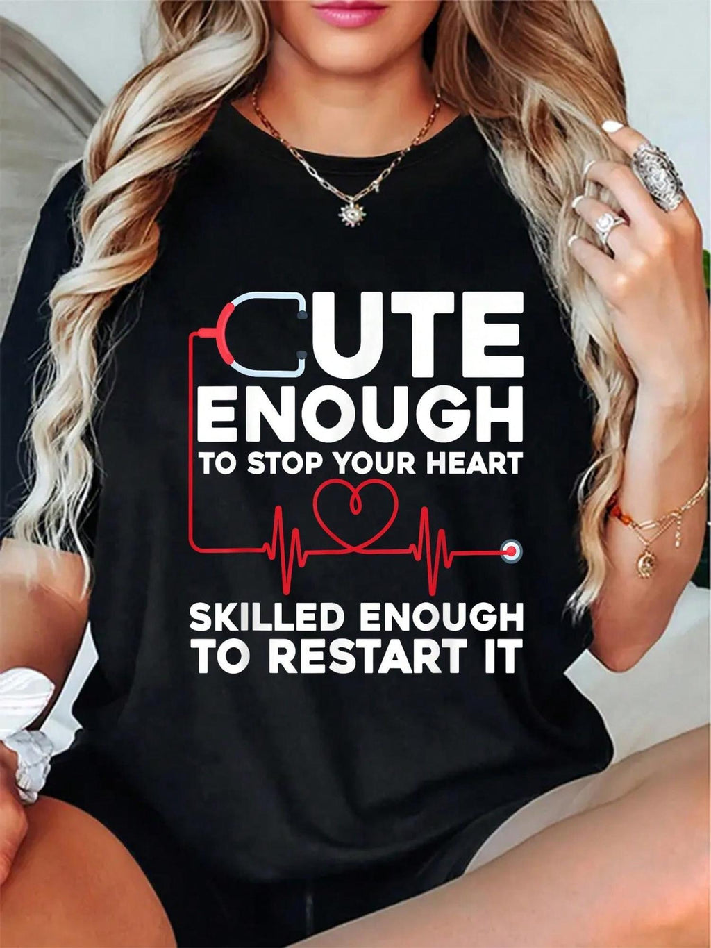 Funny Nurse Graphic T-Shirt for Men & Women - "Cute Enough to Stop Your Heart Skilled Enough to Restart It" Slogan with Stethoscope & Heart Design - Black Round Neck Short Sleeve Casual Tee - Machine Washable Nursing Apparel,