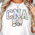 Women's CNA Nurse Bunny Graphic T-Shirt - 100%, Short Sleeve, Round Neck, Machine Washable, Playful Easter Design with Colorful Bunny Ears & Stethoscope, Spring/Summer Casual Tee for, Spring Fashion Top | Casual Round Neck |